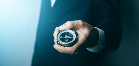 Orientation Concept- analogic compass on man handの写真素材