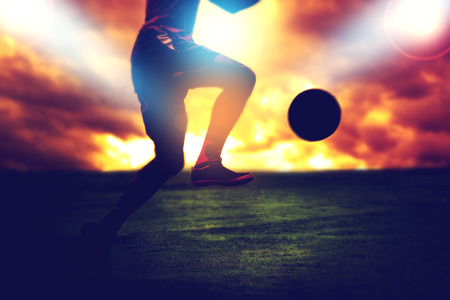 Shoot of football player on the outdoor fieldの写真素材