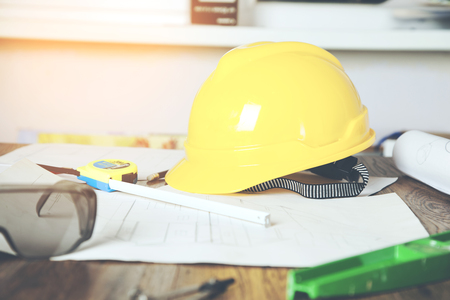 architectural plans with tools on the tableの写真素材