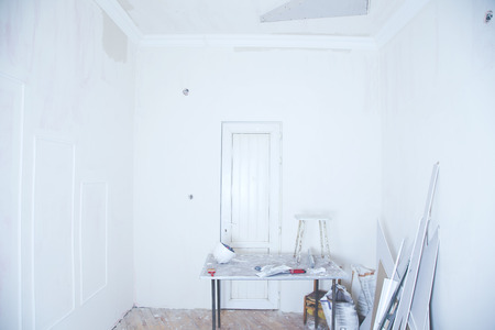 interior with empty whiteboard, table with objects and other items.の写真素材