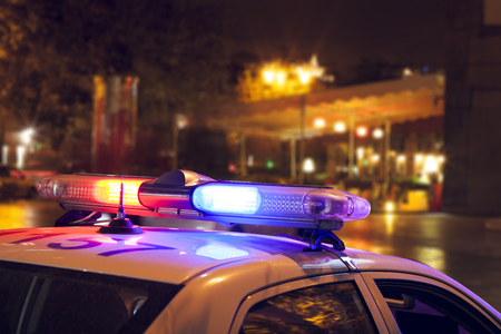 Police car on the street at nightの写真素材