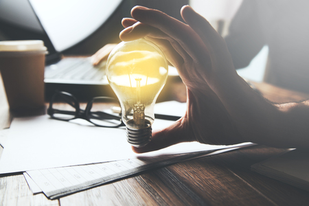 businessman hand idea or light bulb  with keyboardの写真素材
