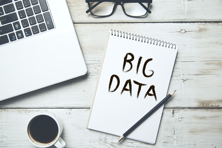 big data text on notepad with keyboardの写真素材