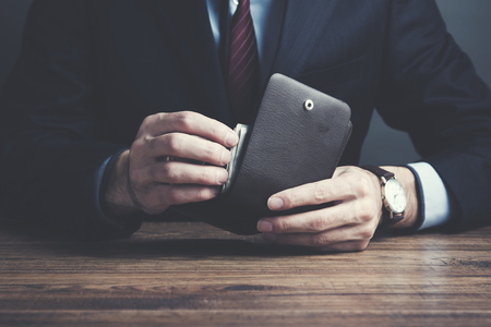 man hand wallet and money on table