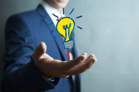 man hand idea or light bulb in screenの写真素材