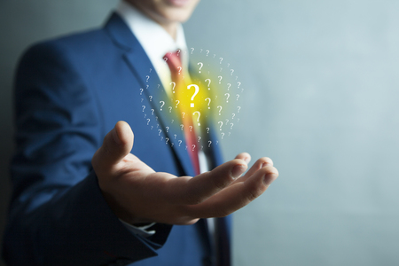 business man hand question mark in screenの写真素材