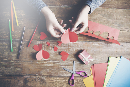 woman hand heart made of paper on Valentine's Dayの写真素材