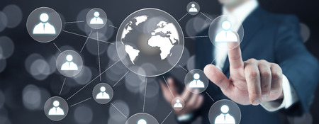 Male hand world icon in the screenの写真素材