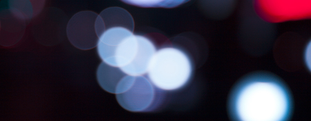 Retro toned colorful bokeh light dark backgroundの写真素材