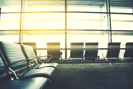 Airport terminal, people going to airplane in backgroundの写真素材