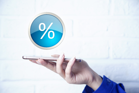 man hand smart phone with percent icon of media screenの写真素材