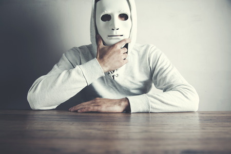 man face mask on the dark backgroundの写真素材