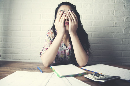 young depression businesswoman hand document and calculator