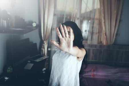 Young beautiful woman at home with open hand doing stop signの写真素材
