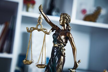 The Statue of Justice on the home background
