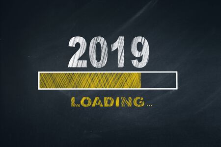 Business Person Drawing Loading 2019 on Blackboardの写真素材