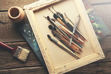 drawing brushes on canvas on tableの写真素材