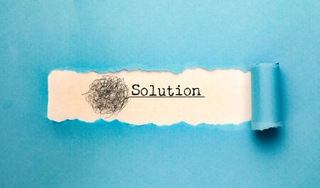 Solution text  with torn paperの写真素材