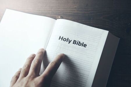 man hand Holy Bible textの写真素材