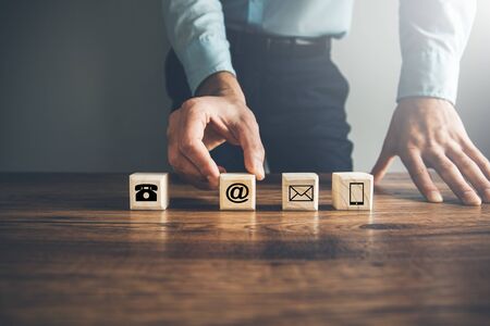 Cubes with contact symbols on tableの写真素材