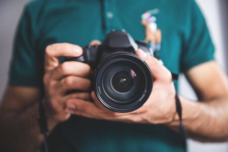 man hand holding photo cameraの写真素材