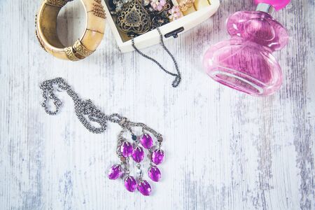 woman accessories with perfume on deskの写真素材