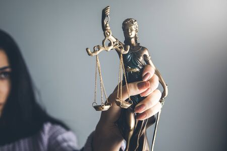 young woman hand justice lady