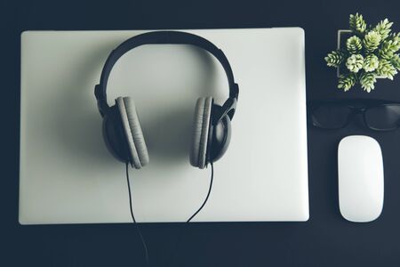 earphone on the computer on deskの写真素材