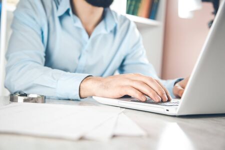 man hand  keyboard on the desk backgroundの写真素材