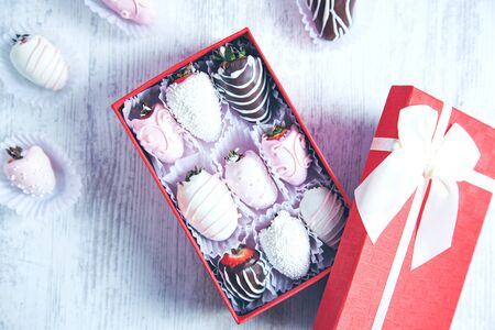 chocolate strawberries on box on the desk