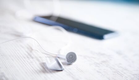 earphone with smart phone on the deskの写真素材
