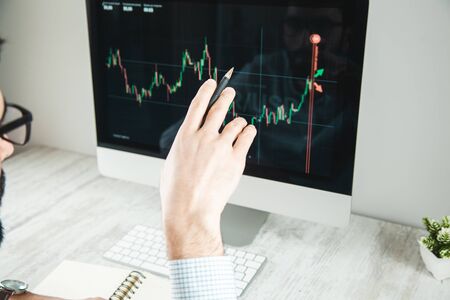 man with  trading computer screen background