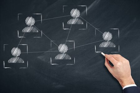 business man written team network  in boardの写真素材