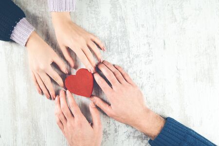 couple hand red heart on the table