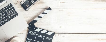 movie sign with computer and camera on desk