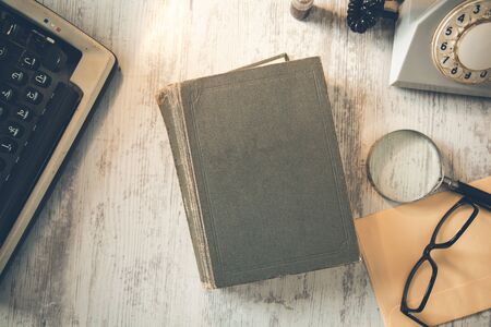 book with typewriter on the desk backgroundの写真素材