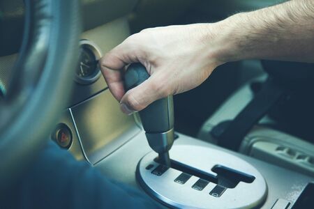 the young man driving car background .の写真素材