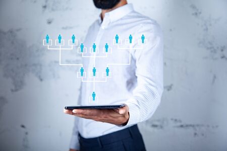 man hand phone with team network in screenの写真素材