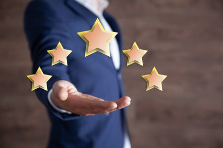 man hand stars in screen on brown background