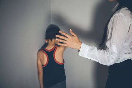 sad baby with angry woman in homeの写真素材