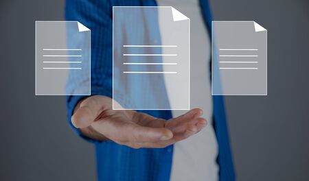 man touching files in screen on grey background