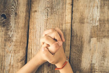prayer girl hand on the desk background