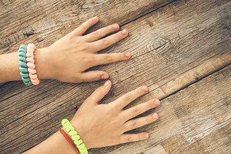 Palm of little girl on the desk backgroundの写真素材