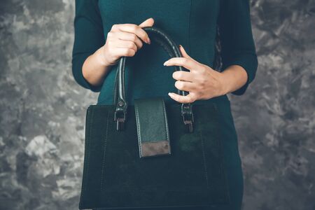 young woman hand bag on abstract backgroundの写真素材