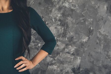 fashionable young woman on the abstract backgroundの写真素材