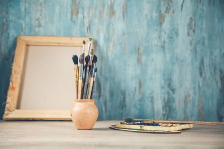 paint brushes on the desk on abstract backgroundの写真素材