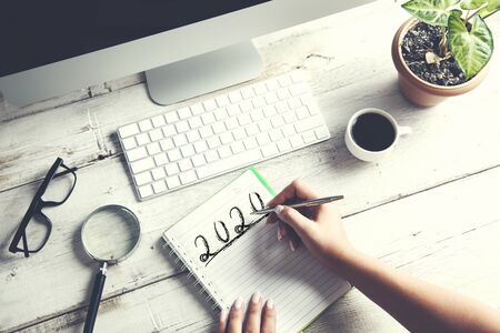 woman hand 2020 with coputer on the desk