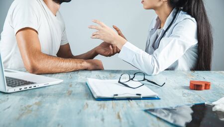 doctor and ill in working table background