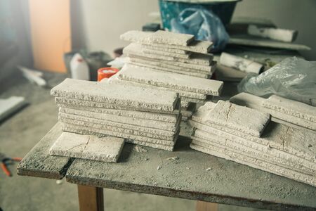 white plaster brick in a factory backgroundの写真素材