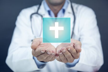 doctor  hand cross sign in screen on blue backgroundの写真素材